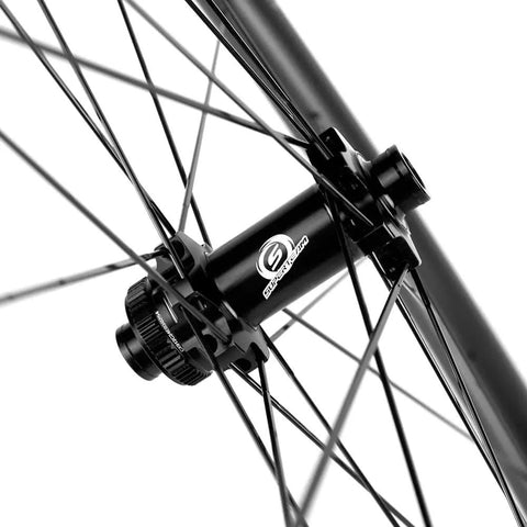 Close-up of the hub and spokes on a Tubeless Carbon Fiber Wheelset 38mm And 31mm For 700c Road Bikes, Disc Brake, UCI Approved.
