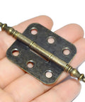 Top Shelf Vintage Folding Hinges With Screws Rock Solid Antique Bronze Zinc Alloy Hardware For Diy Projects Wooden Crates Cabinets And Keepsake Cases Easy Peasy Install And Dang Fine Finish shown in hand.
