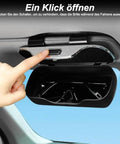 Premium Abs Sunglasses Holder For Tesla Cybertruck Sun Visor showing one hand pressing the quick release button to open.