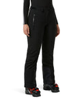 Model wearing Alphelia 2.0 Women's Ski Pants Insulated Waterproof Snow Trousers Black 990 X Small with boots