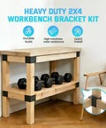 Wood workbench using 8 Pack Heavy Duty 2x4 Workbench Brackets Set with black powder coat, supporting dumbbells, in a room corner.