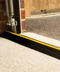 Beefed Up Garage Door Threshold Seal Kit With Adhesive And Bottom Weather Stripping For 10 Ft 6 In Wide Doors, close-up installation