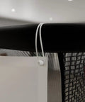 Close-up of top corner detail of Pro Series 9 Flex Golf Simulator Screen For Home Practice, showing attachment to frame.