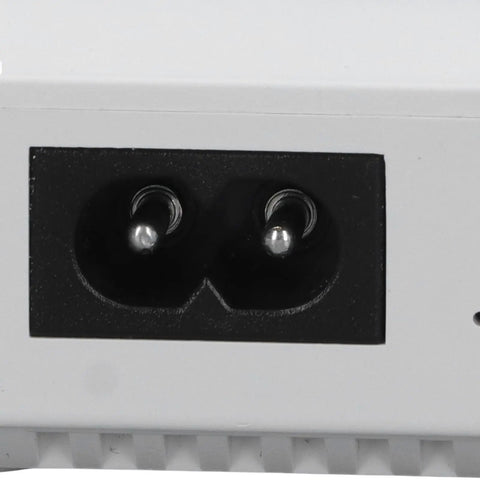 Solid Mini Ups With Six Thousand Mah Battery To Keep Your Wifi Router And Modem Running Smooth Through Power Blackouts And Internet Downtime Without A Hitch At Home Or Office power input socket close-up.
