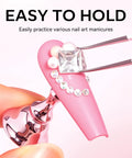 Close-up of Nail Art Display Stand For Practice And DIY Nails, Magnetic Pro Grade Nail Holder With Double Sided Tape showing rhinestones being applied