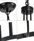 Close-up details of Six Light Wagon Wheel Chandelier In Black Industrial Farmhouse Style, showing chain, arm, and base design.