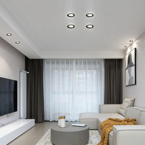 Living room featuring Round Led Recessed Spotlights, Slick Brushed Brass And Matte Black Trim, 5W And 7W Options.