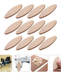 100 Piece Pack Beech Wood Joining Biscuits Deliver Rock Solid Bonds When Gluing Wooden Boards Together While Making Carpentry Work Dead Simple With Every Biscuit Joiner arranged on a surface.
