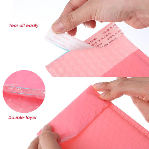 Close-up of pink bubble mailers 12x18cm self seal padded shipping envelopes pack of 60 showing adhesive strip being peeled.