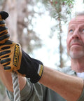 Man climbing rope wearing Rugged Rolltop Seamless Fingertips Leather Work Gloves With Kevlar Reinforcements For Maximum Dexterity