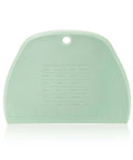 Green plastic measuring chart tool with cup-to-ml conversion and built-in ruler, hanging hole.