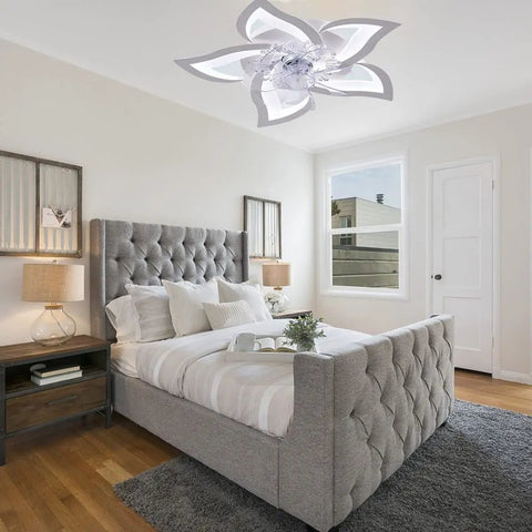Joy Flower 25.6 Inch Modern Flush Mount Ceiling Fan With Lights Remote Control 3 Color Temperatures Petal LED Light Kit in a bedroom