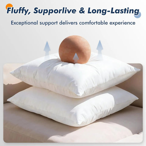 Pack Of 2 12x20 Outdoor Pillow Inserts Water Resistant And Waterproof Lumbar Cushions stacked on sofa with ball on top