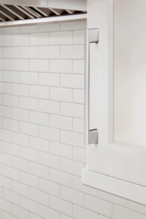 Installed Polished Chrome Cabinet Pull Cityscape Collection 7-3/8 Inch on white cabinet against subway tile backsplash