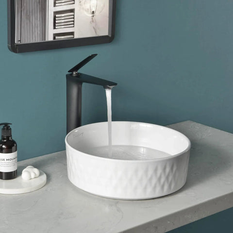 Round Ceramic Vessel Bathroom Sink With Pop Up Drain, Above Counter Vanity Sink For Modern Bathrooms, 14.2 Inch White Ceramic Vessel Sink, Go-To Countertop Choice, Easy Clean, European Modern Look in white with water flow.