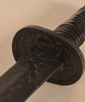 Close-up of Tough As Nails Heavy Duty Polypropylene Practice Sword For Martial Arts with intricate hilt design and textured blade