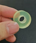 Built To Last Polyurethane Vibration Damping Washers 8 Pack Oil Resistant Shock Absorbing Mounting Pads close-up in hand.