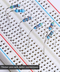 ELEGOO resistor kit on breadboard; assortment of blue 1% resistors with color bands and bent leads