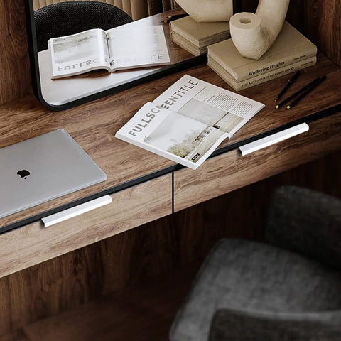 Six Pack Finger Edge Drawer Pull Handles In Bright White For Cabinets And Kitchen Drawers Hidden Mount Aluminum Hardware shown on wooden desk