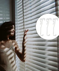 Twelve Pack Transparent Valance Clips For Window Blinds Engineered With Heavy Duty Hidden Channel Brackets shown near window.