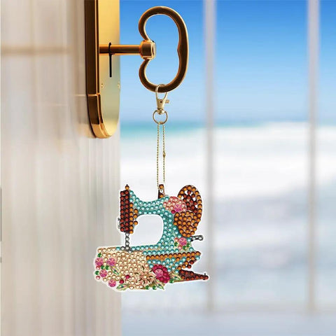 Six Piece DIY 5D Sewing Machine Diamond Painting Keychain Kit Set hanging on a key hook