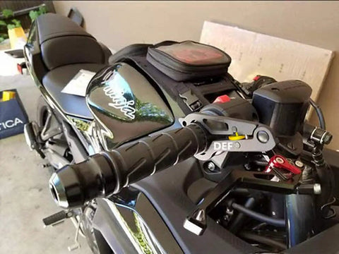 Close-up of Universal Motorcycle Cruise Control with Aluminum Wrist Grip Lock Clamp and Silicone Ring Protector on handlebars.