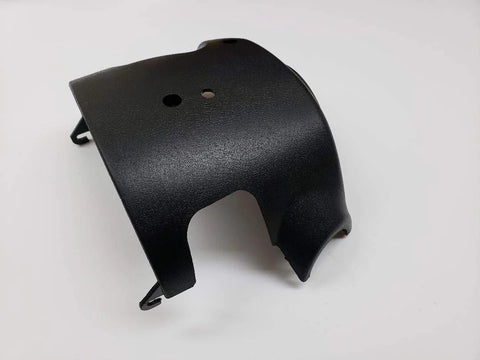 Angled front view of black plastic steering column shroud cover for Silverado tilt steering, 1999–2002.