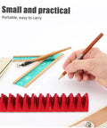 12 Piece Plastic Wrench Storage Organizer Tray in red for garage and workshop, shown with pencils and rulers on a desk