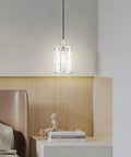 Crystal pendant light with brushed nickel finish hanging above a wooden shelf in modern room. Three Pack Crystal Hanging Pendant Lights 5.5 Inch With Brushed Nickel Finish For Kitchen Island Bar And Dining Room Modern Sleek Pendant Fixture With Crystal Metal Shade For Corridor Living Room Over Sink.