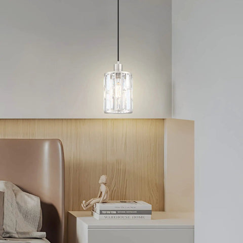 Crystal pendant light with brushed nickel finish hanging above a wooden shelf in modern room. Three Pack Crystal Hanging Pendant Lights 5.5 Inch With Brushed Nickel Finish For Kitchen Island Bar And Dining Room Modern Sleek Pendant Fixture With Crystal Metal Shade For Corridor Living Room Over Sink.