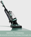 Lightweight Bagless Upright Vacuum With Massive Dust Cup And Smooth Swivel Steering Built As A Straight Shooter positioned for corner cleaning.