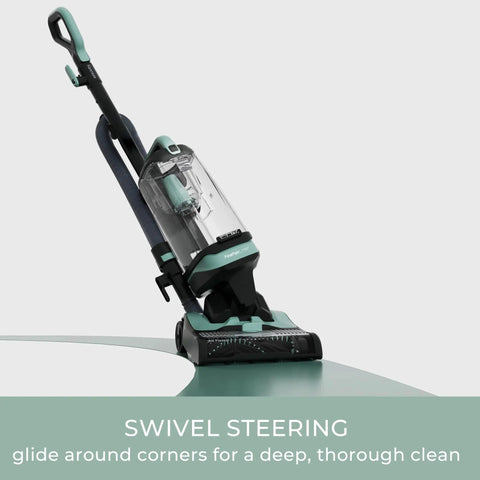 Lightweight Bagless Upright Vacuum With Massive Dust Cup And Smooth Swivel Steering Built As A Straight Shooter positioned for corner cleaning.