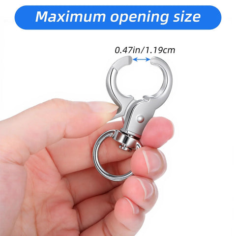 Close-up of a silver metal trigger snap hook with swivel ring, held by fingers.