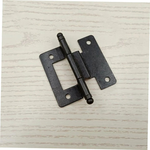 Black heavy duty cabinet hinges on white wood surface