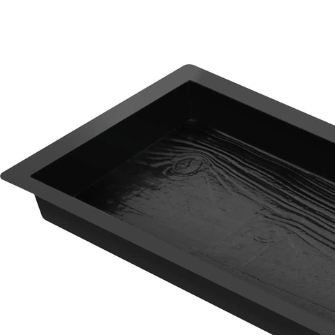 Close-up of a black stone mold from 2 Pack Walk Path Maker Stone Mold Paving Paver Molds For Concrete Reusable Walkways For Patio Lawn Garden Easy To Use