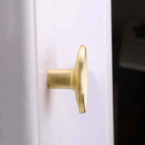 Close-up of a premium quality gold cabinet knob, 38mm wide, durable zinc alloy, ideal for modern kitchen and bedroom drawers.