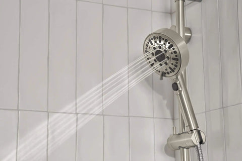 Precept Slide Bar With Brushed Nickel Finish, Easy Dial To Switch Hand Shower Spray Settings, showing water spray on tile wall