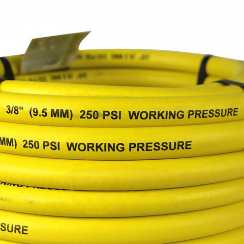 Built Tough As Nails 50 Foot Pneumatic Air Hose With 3 8 Inch Diameter And 250 Psi Rating Featuring Solid Brass Npt Fittings Grease Shedding Epdm Rubber Wrap For Serious Shop Hustles, close-up of yellow hose showing diameter and pressure ratings.