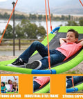 Boy relaxing on Platform Swing Giant Rectangular Saucer for Kids and Adults with industrial steel frame, backyard ready