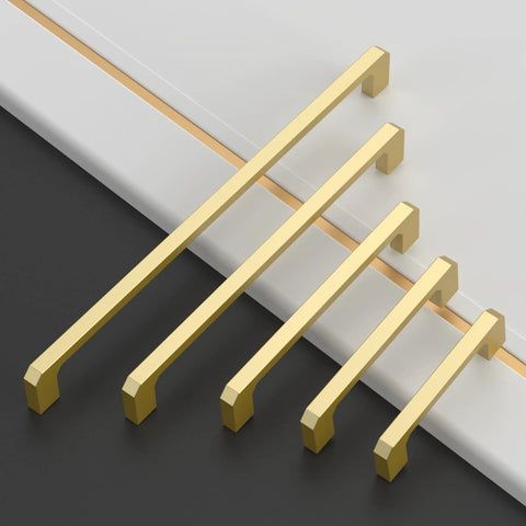 Brushed Gold Cabinet Pulls Set Of 10 5 Inch 128mm Brushed Brass Kitchen Cabinet Handles displayed in varying sizes on a black and white surface