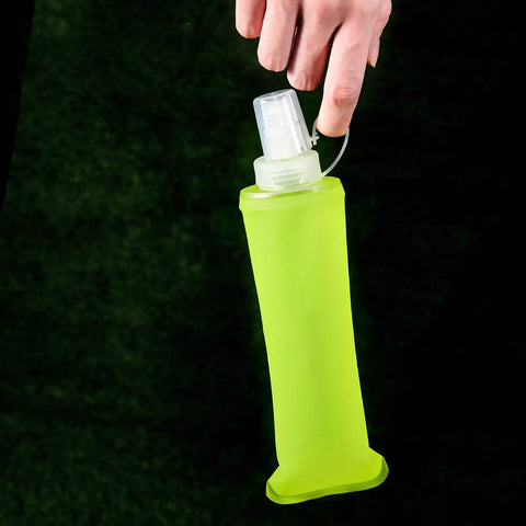 Person holding a Leak Proof Folding Water Bottle With Sport Design, All Day Hydration, Spill Proof Soft Bottle.