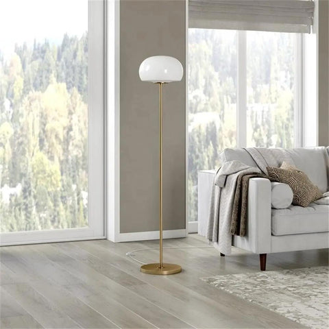 Tall Floor Lamp With Glass Mushroom Shade In Brass and White Milk Glass next to sofa, 8-foot cord visible, ideal for living room