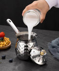 Pouring milk into the Turkish Coffee Pot Cezve Ibrik 200ml Stainless Steel Stove Top Brewer With Spout For Espresso And Traditional Turkish Coffee