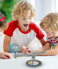 Kids engaging with the Straight Up Premium Sun Earth And Moon Orbital Model Solar System Educational Display For Astronomy Science Teaching And Classroom Learning Tools That Break Down Space Mechanics.