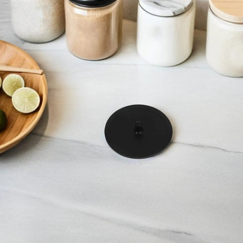 Espresso Machine Cleaning Disc 50mm Silicone Blind Filter Backflush Pad For Semi Automatic Coffee Makers shown on kitchen counter