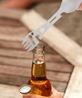 Using Two Piece Outdoor Spork And Fork Set Made Of Stainless Steel Reusable Flatware With Built In Bottle Opener on beer bottle
