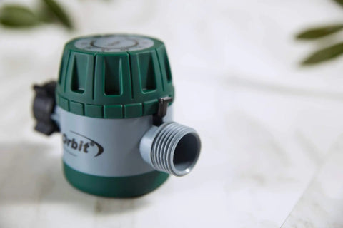 Close-up of mechanical water timer for lawn and garden with easy grip dial and manual bypass, no battery needed.