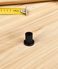 Single piece from Three Piece Barn Door Track Spacers Kit In Carbon Steel with black finish on wooden surface