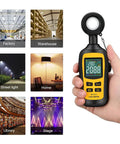 Hand holding Digital Illuminance Meter Handheld Light Meter with Ambient Temperature Range 0 to 200000 Lux 4 Digit Color LCD Screen