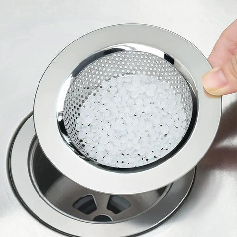 2 Pack Kitchen Sink Strainer Basket Rust Resistant Stainless Steel Large Food Catcher showing strainer with white beads in kitchen sink.